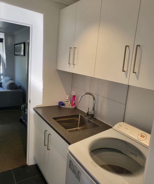 Howick Laundry with New Wall Cabinets After