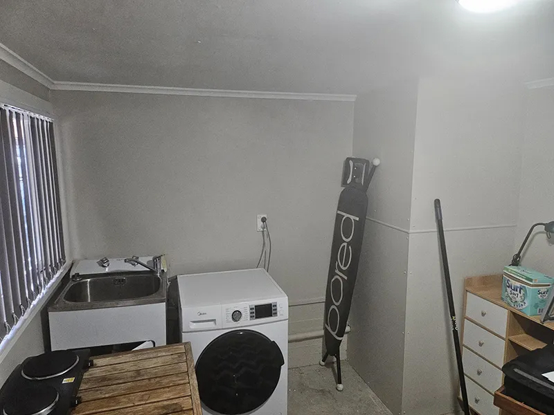 Laundry room replacement in Avondale with storage before